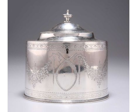 A GEORGE III SILVER TEA CADDY by Hester Bateman, London 1787, oval, with bright-cut engraved decoration. 15cm wide, 15.1 troy