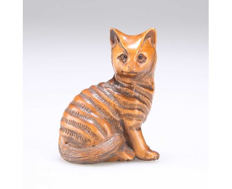 A JAPANESE CARVED WOOD CAT NETSUKE signed. 5cm high