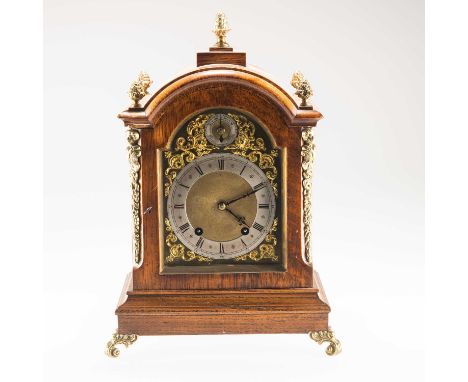 A BRASS-MOUNTED OAK TABLE CLOCK, SIGNED GLOVER, LINCOLN, CIRCA 1900 the arch-top case with five brass finials, the brass dial