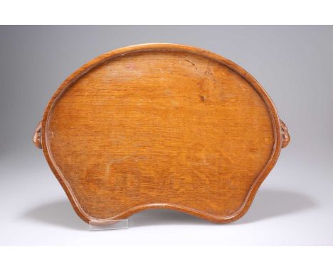 ROBERT THOMPSON OF KILBURN, A MOUSEMAN OAK TEA TRAY kidney-shaped, adzed, with carved mouse signature handles. 47cm wideMice 