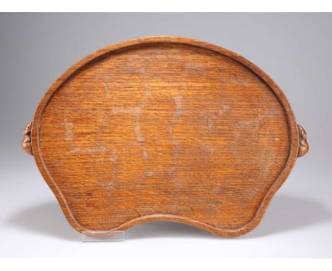 ROBERT THOMPSON OF KILBURN, A MOUSEMAN OAK TEA TRAY kidney-shaped, adzed, with carved mouse signature handles. 47.5cm wideTin