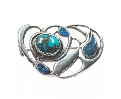 WILLIAM HAIR HASELER FOR LIBERTY &amp; CO - A SILVER, TURQUOISE AND ENAMEL BROOCH an open work scroll frame set with a turquo