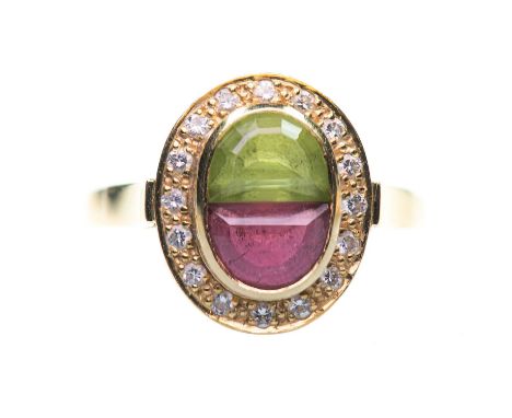 AN 18 CARAT GOLD PERIDOT, PINK TOURMALINE AND DIAMOND CLUSTER RING D-cut peridot and pink tourmaline within a border of round