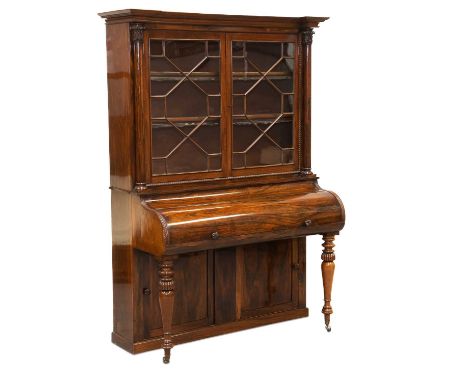 A WILLIAM IV ROSEWOOD 'PIANO' SECRÉTAIRE BOOKCASE the upper section with a pair of astragal glazed doors enclosing adjustable