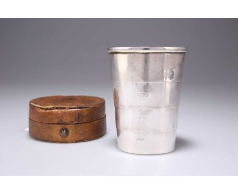 A GEORGE V SILVER COLLAPSIBLE BEAKER CUP by Percy Whitehouse, London 1914, in a leather case. 9.5cm high extended/assembled, 