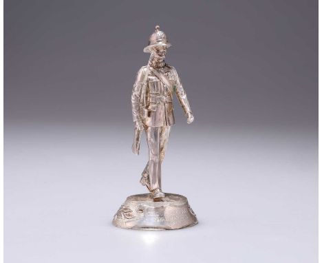 AN ELIZABETH II CAST SILVER FIGURE OF A ROYAL MARINES COMMANDO SOLDIER maker BP, London 1986, titled COLOUR SERGEANT / ROYAL 