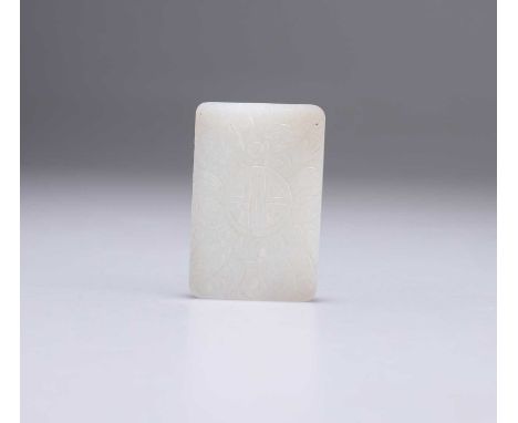 A CHINESE JADE PLAQUE rectangular. 5.5cm by 3.8cm