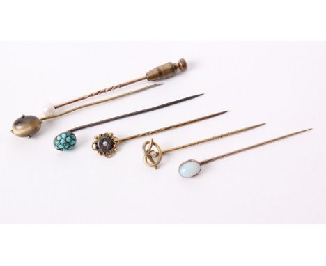 Six Victorian and later gem set unmarked yellow metal gets tie pins, set with opal, tigers eye, pearl and turquoise, 8.3g gro