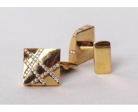 A pair of 18ct gold and diamond cuff links by Boodles &amp; Dunthorpe, each set with four lines of single cut diamonds, total