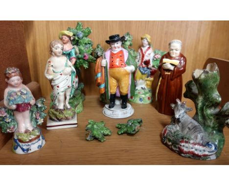 A 19th Century English pottery spill vase, with a mountain goat; together with six other pieces of similar period pottery and