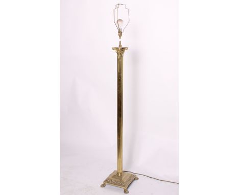 A brass standard lamp of Corinthian design, 137cm high.