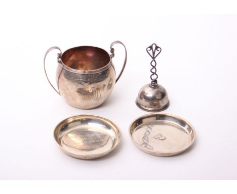  A Sterling silver sugar bowl with gilded interior; together with two sterling silver pin dishes and a hand bell marked sterl