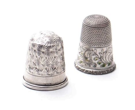 A sterling silver thimble, and a white metal thimble (2).