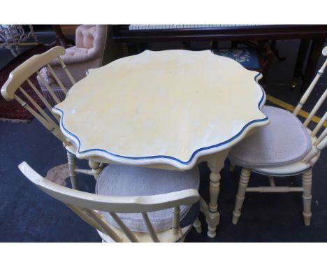 A cream painted dining table, 90cm, and set of matching stick back dining chairs (5)