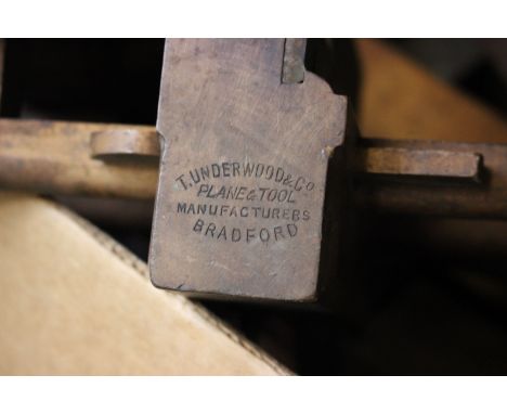 A carpenter’s moulding plane by T. Underwood &amp; Co. Bradford, together with other planes and woodworking tools.