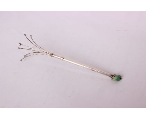 An unmarked white metal telescopic cocktail stirrer or swizzle stick, with carved jade elephant finial.