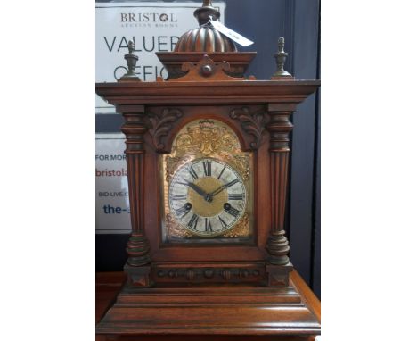 A late 19th Century carved mahogany Greenwich mantel clock with striking movement and Roman Numeral markers and gilt brass di