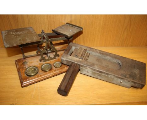 A set of brass postal scales with weights (some vacant) together with a WWII Trench Gas Alarm rattle marked 'RCD' 1945 (2).