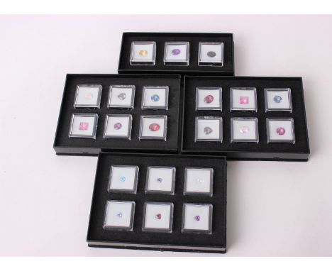 A collection of un mounted boxed collectors gem stones, to include twelve Mystic topaz, and a collection of Trillion cut ston