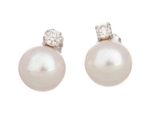 PAIR OF PEARL AND DIAMOND EARRINGS set with spherical pearls, the diamonds totalling approximately 0.26 carats, in nine carat