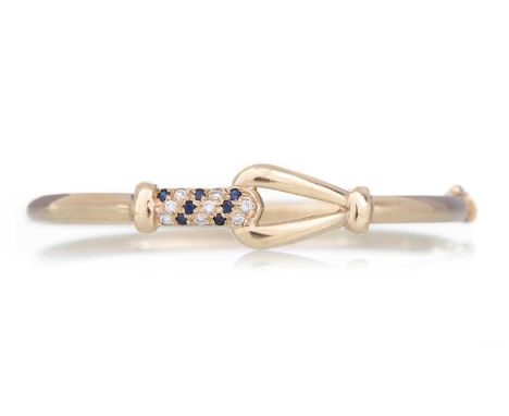 SAPPHIRE AND DIAMOND BANGLE set with small round stones, in nine carat goldQty: 7.2gGenerally worn. All stones intact. Clasp 