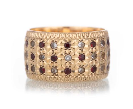 RUBY AND DIAMOND RING set with three rows of small round stones, some stones missing, in nine carat gold, size QQty: 9.2g