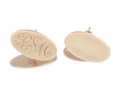 PAIR OF CUFFLINKS IN NINE CARAT GOLD  formed with engine turned and monogrammed oval panelsQty: 6.5g