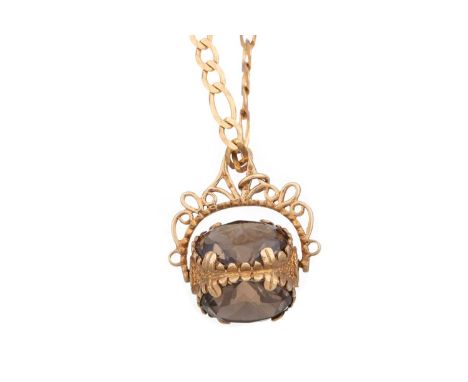 GEM SET SWIVEL FOB ON CHAIN the fob set with smoky quartz, on a figaro chain marked 9KT