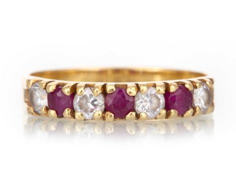 RUBY AND DIAMOND RING  set with alternating stones, marked 18CT, size Q  Qty: 3.6g  Generally worn. Chips to the rubies. Grey