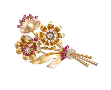 A VINTAGE RUBY AND DIAMOND FLOWER BROOCH in yellow gold and platinum, designed as a bouquet of three flowers accented by roun