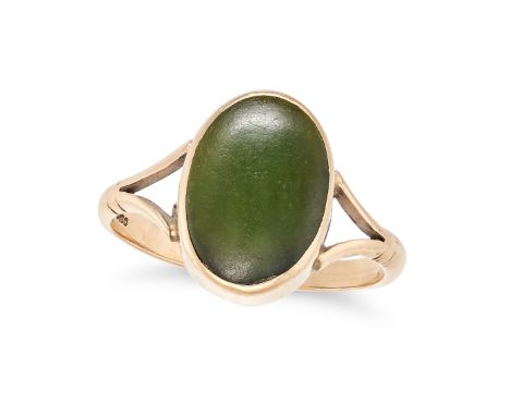 A NEPHRITE JADE RING in 9ct yellow gold, set with an oval cabochon nephrite on a bifurcated band, partial British hallmarks, 