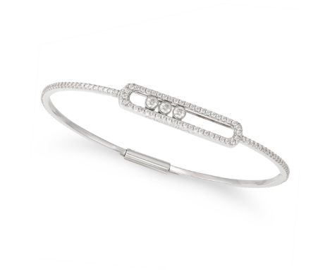 MESSIKA, A DIAMOND MOVE BANGLE in 18ct white gold, set with three moveable round brilliant cut diamonds, set throughout with 