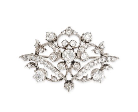 A VINTAGE DIAMOND BROOCH in 18ct white gold, the scrolling body set with old cut diamonds all totalling 4.4-4.7 carats, later