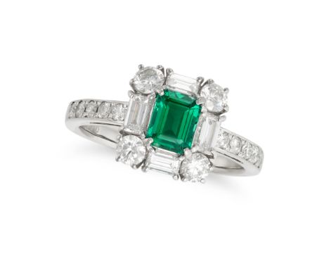 AN EMERALD AND DIAMOND RING in platinum, set with an octagonal step cut emerald of 0.60 carats in a border of round brilliant