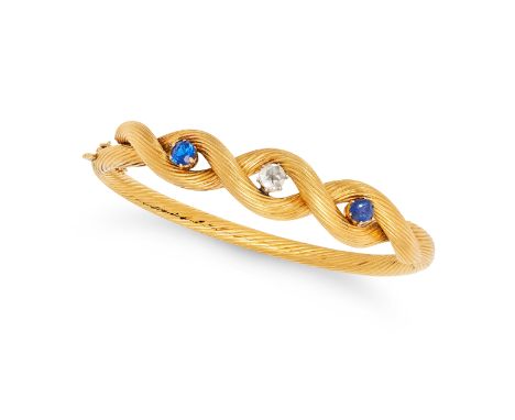 A VINTAGE FRENCH SAPPHIRE AND DIAMOND BANGLE in 18ct yellow gold, the twisted hinged bangle set with a rose cut diamond betwe