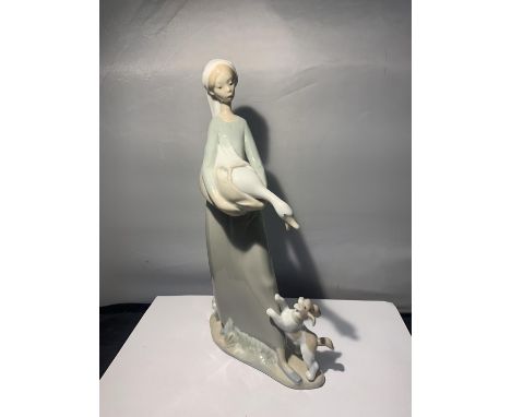 A NAO FIGURINE OF A LADY WITH A GOOSE AND A PUPPY 