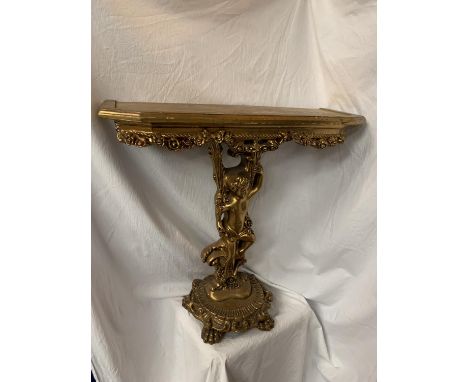 AN ORNATE GILT CONSOLE TABLE IN THE FORM OF A CHERUB H: 76CM 
