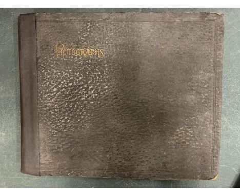 A VINTAGE PHOTO ALBUM,  EARLY TO MID CENTURY 