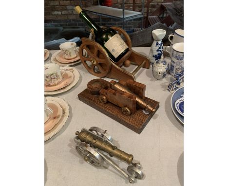 TWO VINTAGE CANNONS AND A BOTTLE HOLDER 