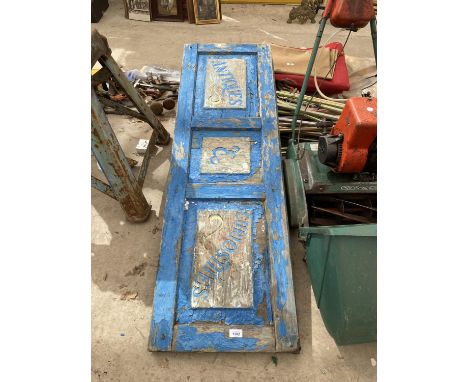A VINTAGE WOODEN 'ANTIQUES AND CURIOSITIES' SIGN 