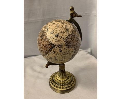 A WORLD GLOBE ON A METAL BASE 