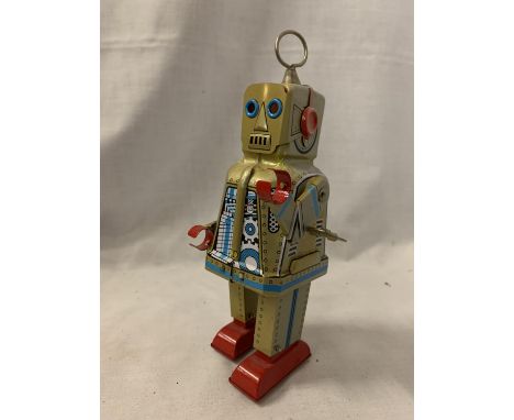 AN OLD CLOCKWORK ROBOT IN WORKING ORDER 