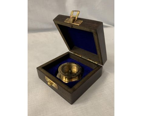 A BOXED 'HENRY HUGHES' BRASS COMPASS 
