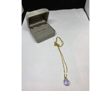 A 9 CARAT GOLD CHAIN WITH A CRYSTAL PENDANT IN A PRESENTATION BOX 