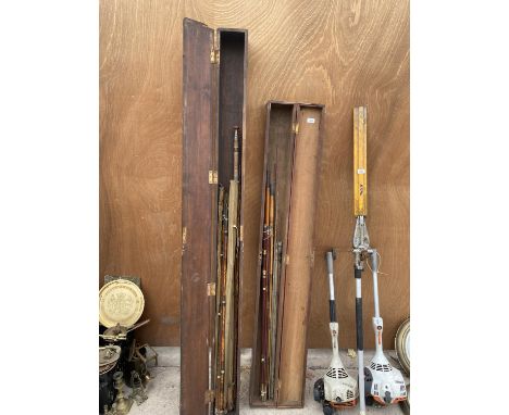 TWO VINTAGE WOODEN STORAGE CASES WITH AN ASSORTMENT OF FISHING RODS TO INCLUDE SPLIT CANES ETC 