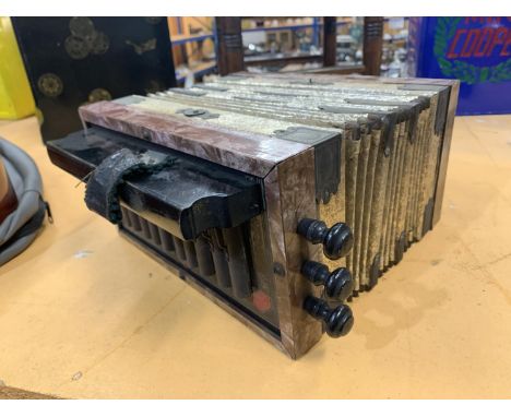 A SMALL VINTAGE GERMAN ACCORDION 