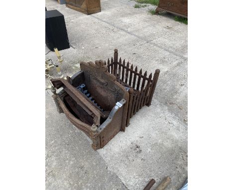 TWO VINTAGE CAST IRON DOG GRATES 