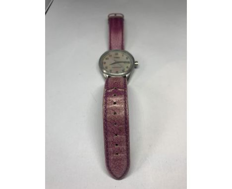 A TIMEX CALENDAR WRISTWATCH IN WORKING ORDER 