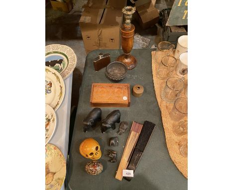 A SELECTION OF TREEN ITEMS TO INCLUDE A MAHOGANY CANDLE STICK WITH BRASS DETAIL, FIVE CARVED ELEPHANTS ETC 