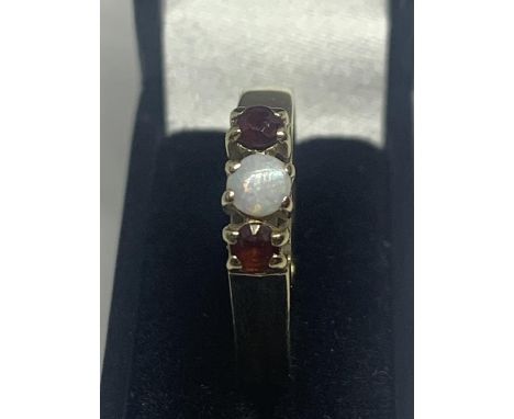 A 9 CARAT GOLD OPAL AND RUBY RING SIZE L WITH A PRESENTATION BOX 